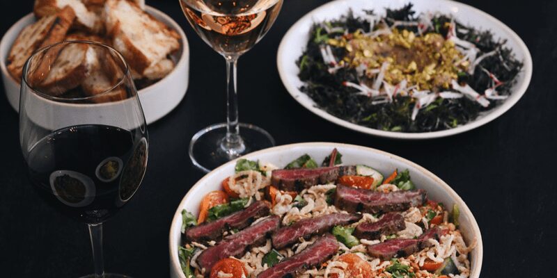 oil on linen, dishes and wine