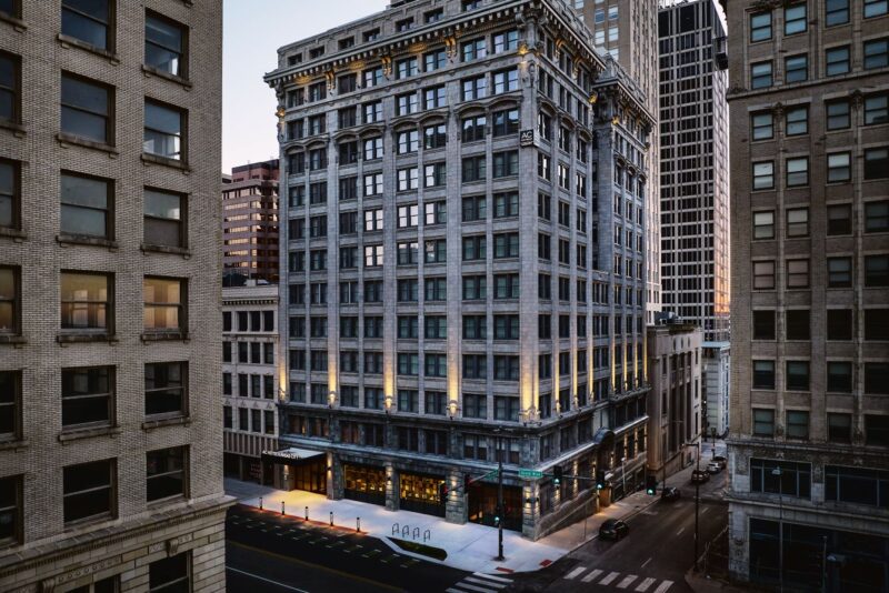 Facade of the AC Hotel in downtown Kansas City during a sunset